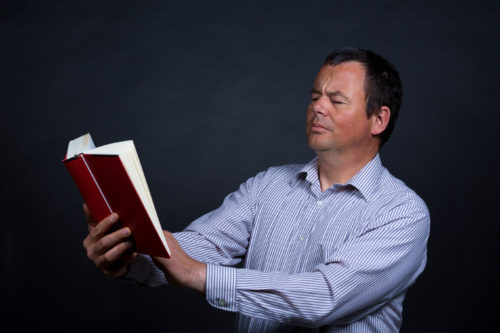 Man finding it increasingly difficult to read without glasses